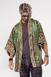 Jungle Rhythm short kimono robe displayed elegantly, highlighting its chic design and versatility for beach to brunch transitions. The wrinkle-resistant silky fabric and obi belt option emphasize its adaptability, while the matching zippered travel pouch demonstrates convenience and thoughtful design for safekeeping on-the-go.