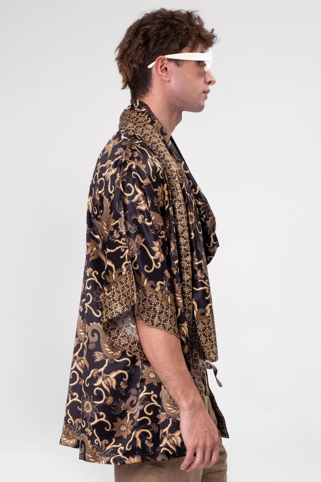 Model wearing Short Obsidian Odyssey Kimono in black and soft brown siren-like pattern.